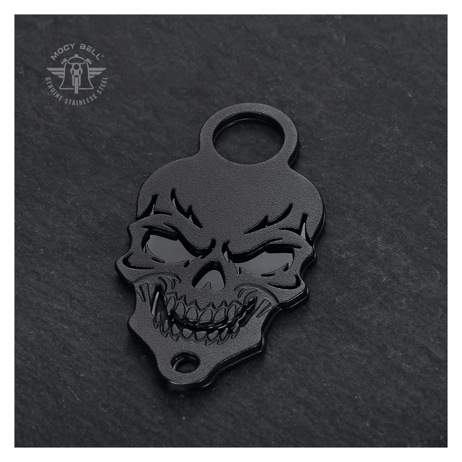 Support clochette moto Skull noir mat posé sur fond sombre texturé