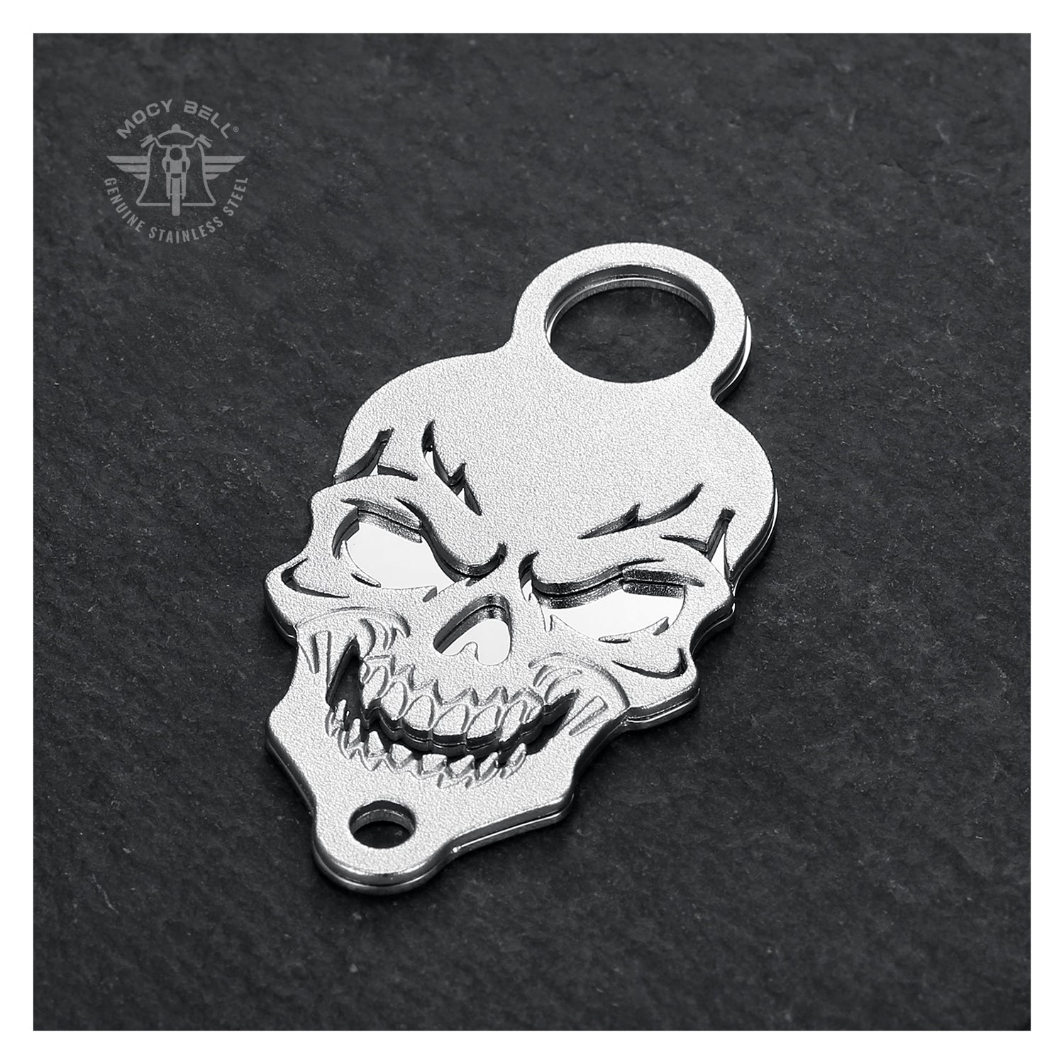 Support clochette moto Skull MocyBell posé sur fond noir texturé