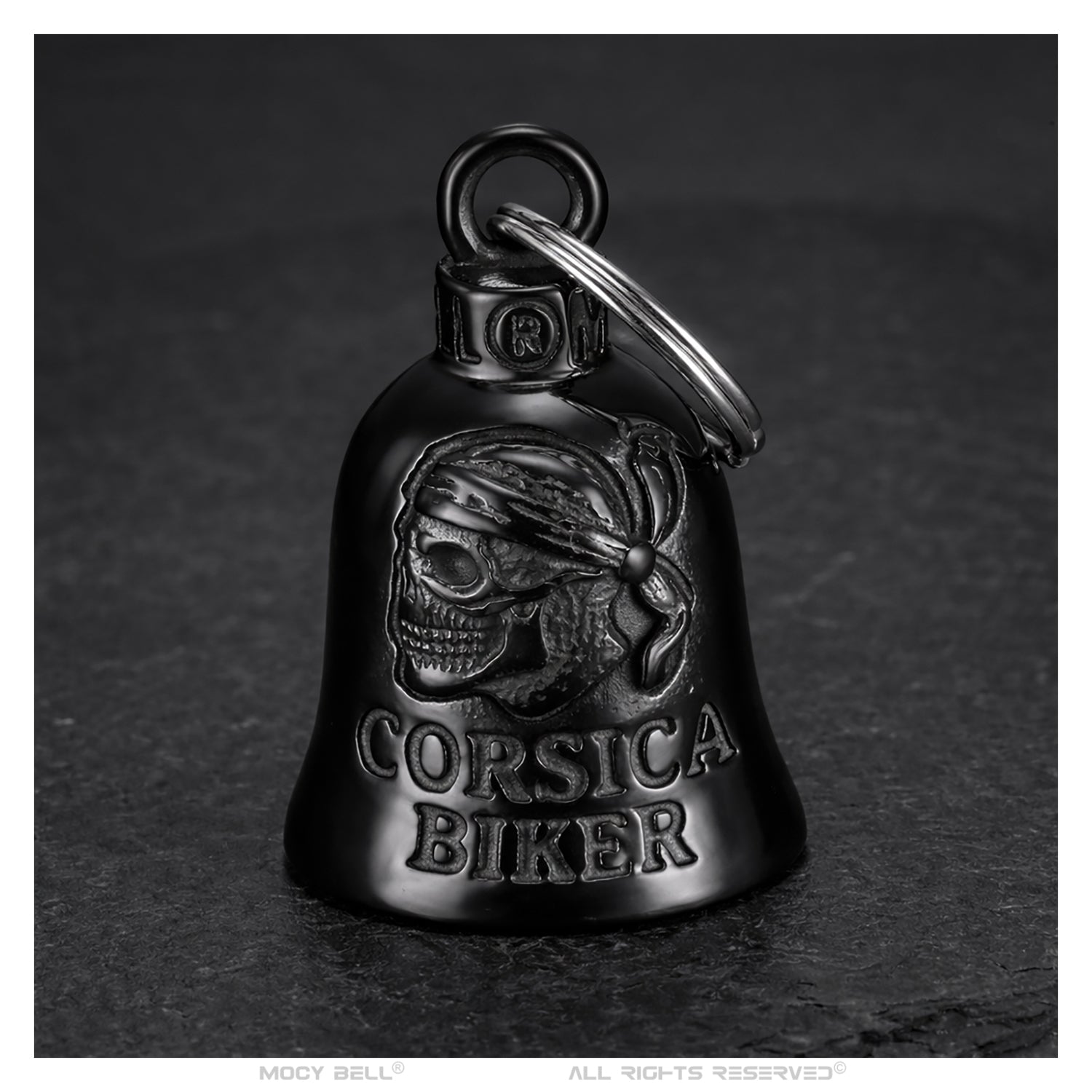 Grelot moto Corsica Biker finition noir titane avec gravure tête de mort et inscription Corsica Biker présenté de face